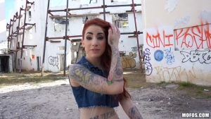 Pretty redhead in mini skirt gets screwed on a construction site