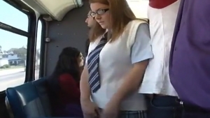 Young tudiante mini skirt is fiddling in a public bus