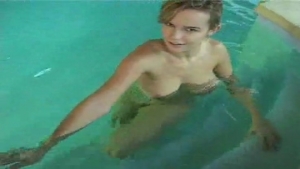 Slut masturbates solo at the pool