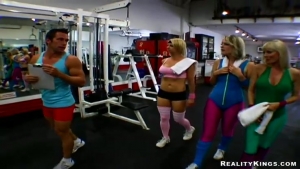 Three hot blondes jump on the cock of the coach in the gym